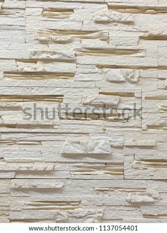 brick background made of natural and artificial stone