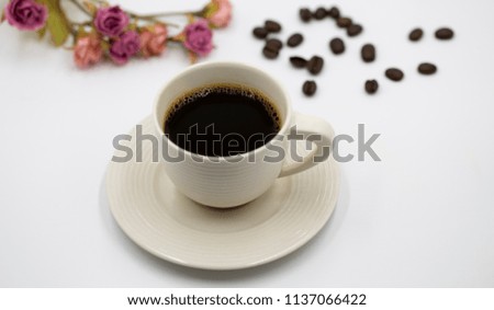 good taste of black coffee in the white cup on the white background