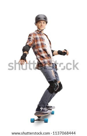 Full length portrait of a teenage boy wearing protective equipment riding a skateboard isolated on white background