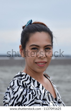 Portrait woman and the sea at Don Hoi lot in Samut songkhram , Thailand.