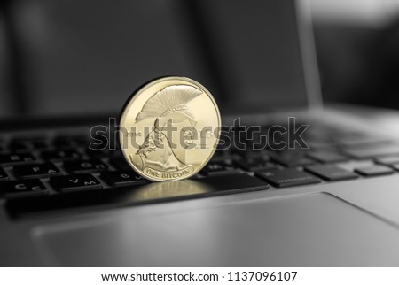 Titan bitcoin coin symbol on laptop. Concept financial currency, crypto currency sign. Blockchain mining. Digital money and virtual cryptocurrency concept. Bussiness, commercial.