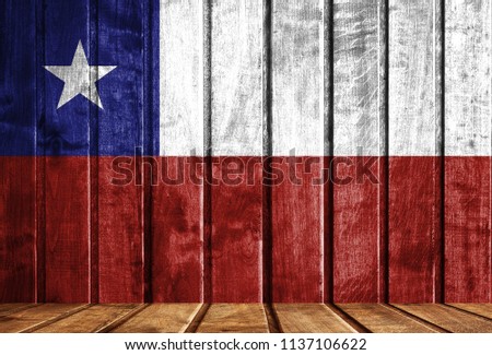 Wooden background with a flag of Chile.