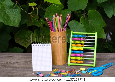 notepad with pencils