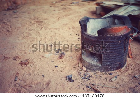Traditional style of clay stove with smut after cooking processed in vintage picture