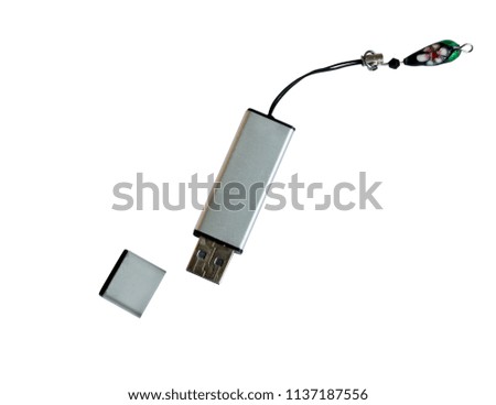 Silver flash drive isolated on white background. Data storage hardware.