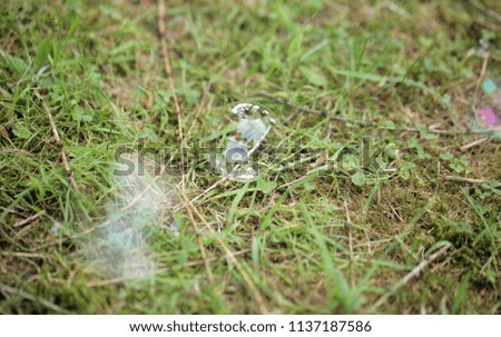 background with room for text - green grass with air bubbles, outdoors on a summer sunny day