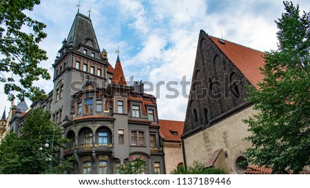 A view of Old-New Synagogue and the adjacent historic apartment building in Prague's Jewish quarter of Josefov Royalty-Free Stock Photo #1137189446