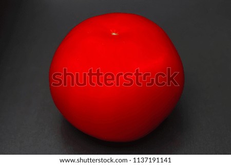 bright colorful red tomato isolated on dark grey black background. fresh healthy food and nutrition vegetarian concept. vegetables salad ingredient.