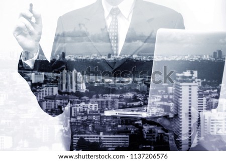 Double exposure of young business man and the city view background to represent successful in investment marketing. Find out the best solution in business and financial as concept.