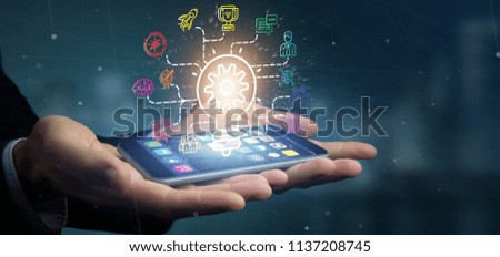 View of a Businessman holding a Bulb lamp idea concept with start up icon connected 3d rendering
