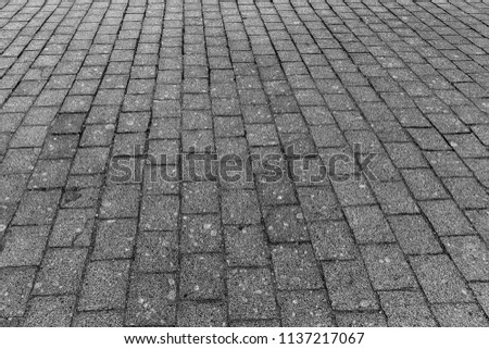 Brick stone street road background. Grey pavement texture