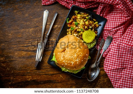 American sloppy joe sandwich with multicolored grilled corn