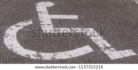 Reserved disable parking sign on road surface