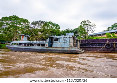 A ship in the middle of the Amazon River, Iquitos, Peru.