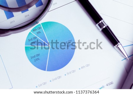 Charts and graphs are placed on the desks, data, and statistical performance of the company in the past year.