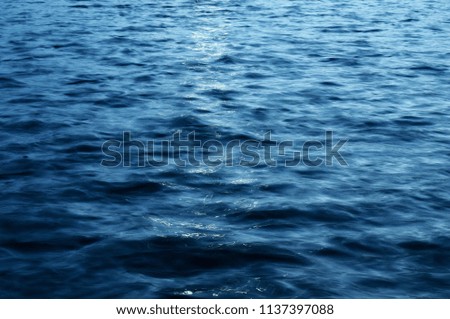 Light reflecting on the surface of water in the lake, low shutter speed.