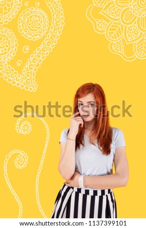 Worried person. Young worried student frowning and thoughtfully touching her face while imagining her future after graduating from the university