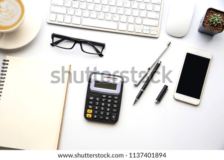 Top view with copy space, working desk with laptop,cell phone,notebook pencil and coffee on white background