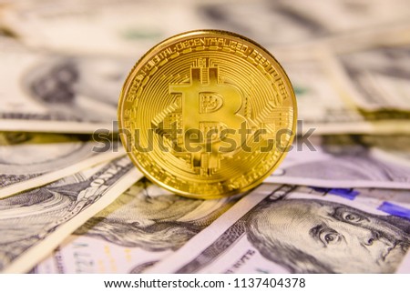 Bitcoin on a one hundred dollar bills