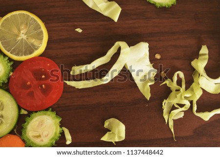 Sliced mixed vegetables on the wooden background royalty free stock images