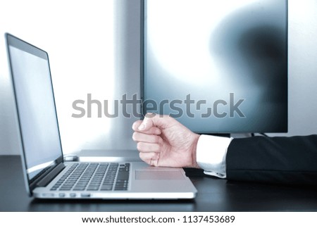 Business man using laptop computer.