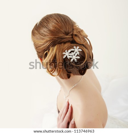 Closeup picture of a bridal hairstyle on white background