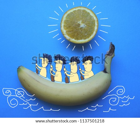 Funny photo showing cartoon natives paddling banana boat with orange sun in sky against blue background