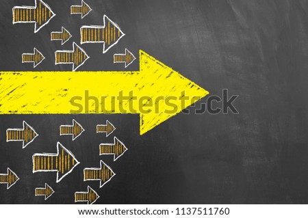 Multiple arrows yellow chalk drawing on blackboard or chalkboard as direction orientation trend pointer concept with copy space Royalty-Free Stock Photo #1137511760