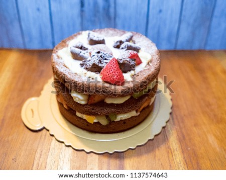 sweet chocolate round cake with fruit