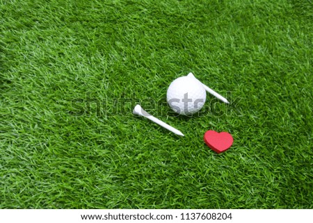   Golf is on green grass                             