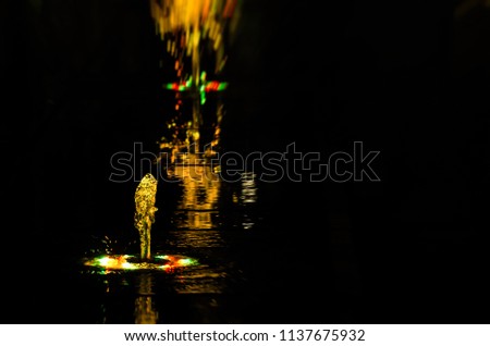 VOLCANO - Colorful fountain in the night city landscape