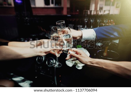 Cheers, my friends. Group of friends celebrating with champagne. Glasses of champagne in hands.