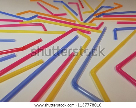 Colorful straws on the white background. 