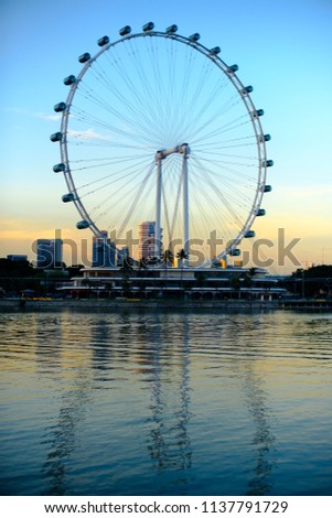 the singapore flyer at sunset