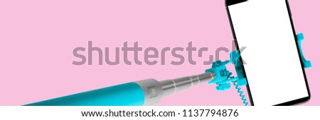 Monopod for selfie with smart phone. Selfie stick with smartphone isolated on pink background, banner
