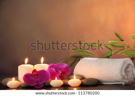 Spa Still life with aromatic candle orchid flower and towel