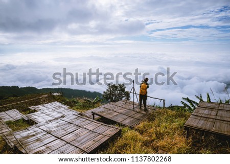 women asians travel relax in the holiday. Photograph landscape on the Moutain.Thailand