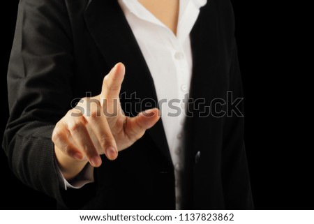 Businesswoman hand pointing finger isolated on black background, clipping path.