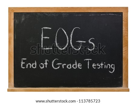 End of Grade Testing written in white chalk on a black chalkboard
