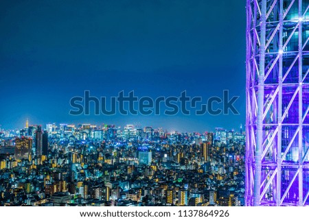 Asia Business concept for real estate and corporate construction - panoramic urban city skyline aerial view under twilight sky and neon night in tokyo, Japan