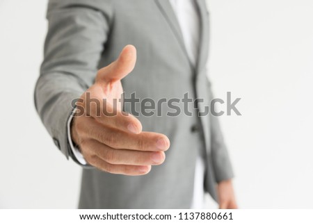 image of Businessman giving his hand for handshake to partner or Investors reassure businessman or foreign partners  shaking hands.Lawyers join hands with clients to confidence and trust. 