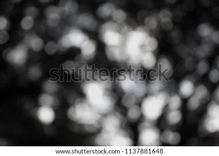 Abstract blurry bokeh black background.