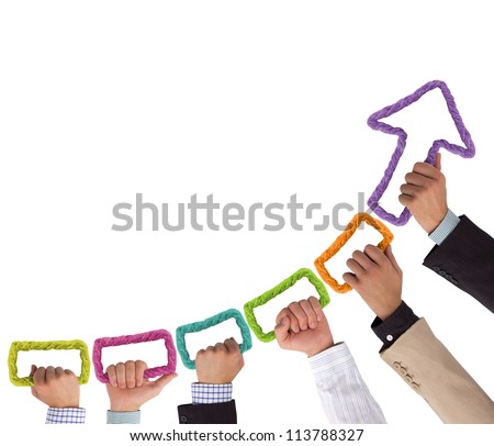 Hands holding colorful rope forming arrow pointing upwards Royalty-Free Stock Photo #113788327