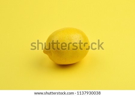 Lemon isolated on yellow background. Space for test or design. Royalty-Free Stock Photo #1137930038
