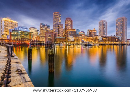 Boston, Massachusetts, USA downtown on the harbor at twilight.