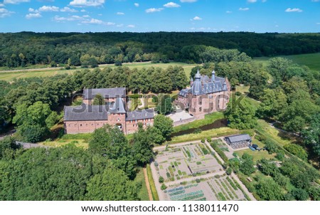 Aerial view of the medieval castle 'Doorwerth', first mentioned in 1260, near the little village 'Doorwerth' in the province of 'Gelderland', the Netherlands Royalty-Free Stock Photo #1138011470