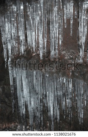Icicles in lava cave. Iceland