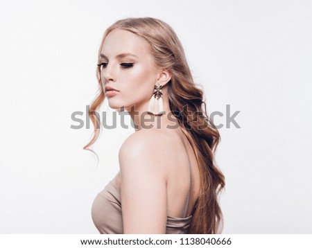 Beautiful blonde womal with long curly fly hair beauty portrait isolated on white