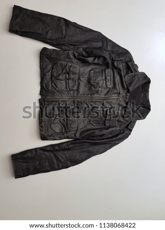 The image of a leather jacket isolated against.