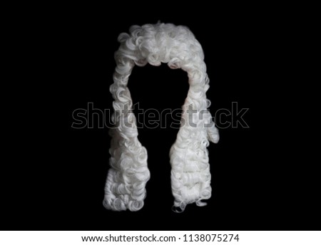 Judge white wig on a black background. Royalty-Free Stock Photo #1138075274